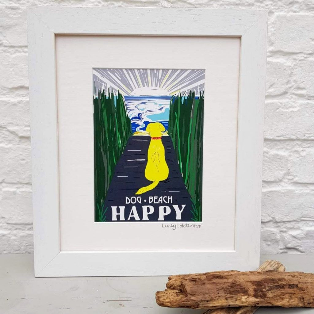 Blonde Beach Dog + Beach = Happy framed print taken from the original lino print artwork from Lucky Lobster Art.