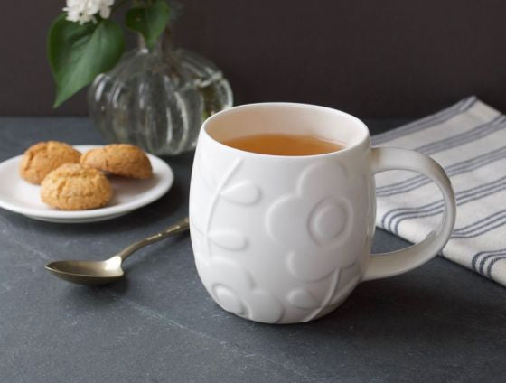 Repeat Repeat's White Bone China Plum Flower mug. Made in England.