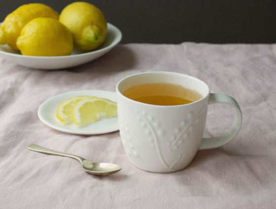 Repeat Repeat's White Bone China Olive Berries mug. Made in England.